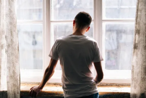 Young man at window